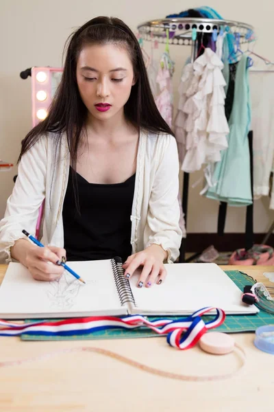 Fashion designer sketching design — Stock Photo, Image