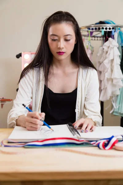 Fashion designer sketching design — Stock Photo, Image