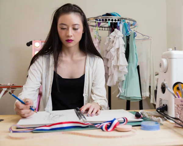 Fashion designer sketching design — Stock Photo, Image