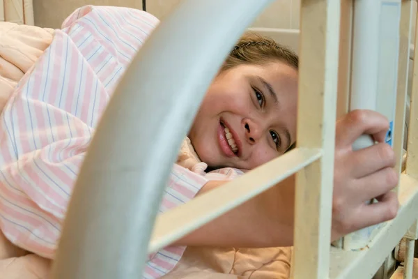 Mixed race tween girl in hospital bed