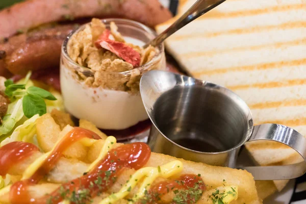 Brunch with german sausage, cereal, French fries and toast — Stock Photo, Image