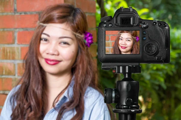 Filipina female social media star in a garden
