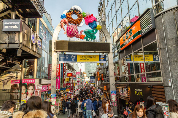 People walk along Takeshita street in Harajuku