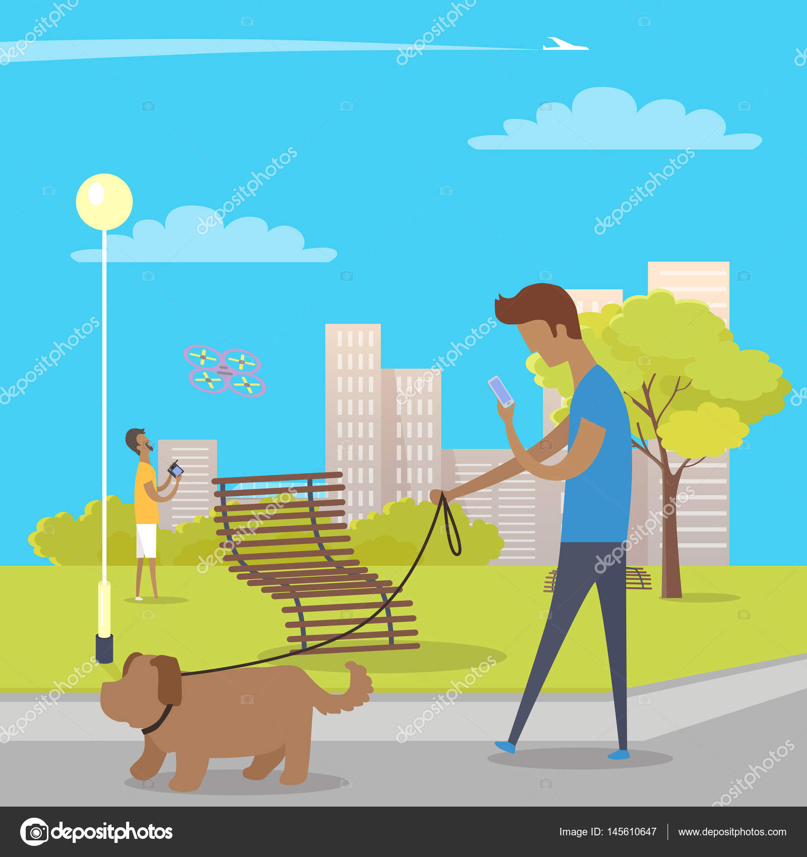 Junge geht mit Hund im Park spazieren und nutzt Smartphone