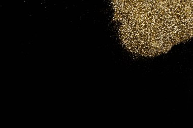 Koyu siyah bir yüzeyde altın parıltı lekesi. Noel, yeni yıl, doğum günü, özel durumlar arka planı, fotokopi alanı olan.