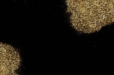 Koyu siyah bir yüzeyde altın parıltı oluşmuş. Noel, yeni yıl, doğum günü, özel durumlar arka planı, fotokopi alanı olan.