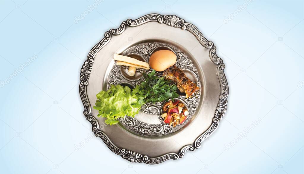 Pesach plate, on a light blue background. Traditional Jewish seder on the occasion of Passover festival.