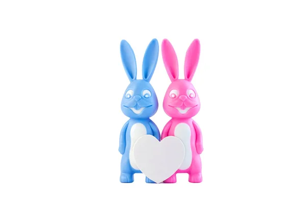 Cute bunnies happy lovers couple with heart on white background isolated, creative Valentine's day card. Minimal style. — Stock Photo, Image