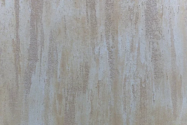 Licht beige perzik met parelmoer glitter gips achtergrond met verticale strepen van uitstrijkjes. — Stockfoto