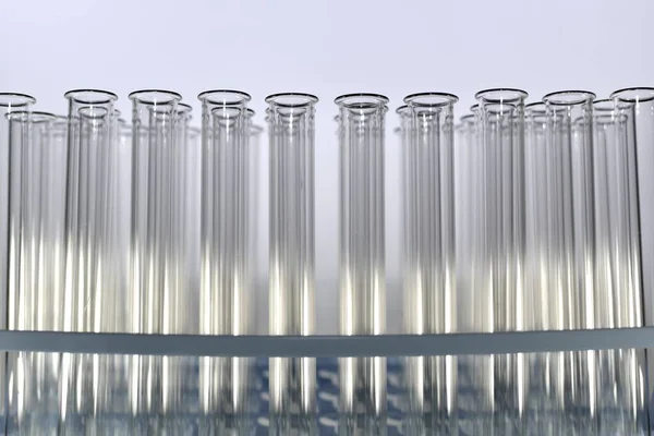 Tray with test tubes with shadows and light enlarged. — Stock Photo, Image