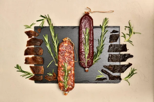 Raw Smoked Beaver Roe Deer Sausages Jerky Wild Sprigs Rosemary — Stock Photo, Image