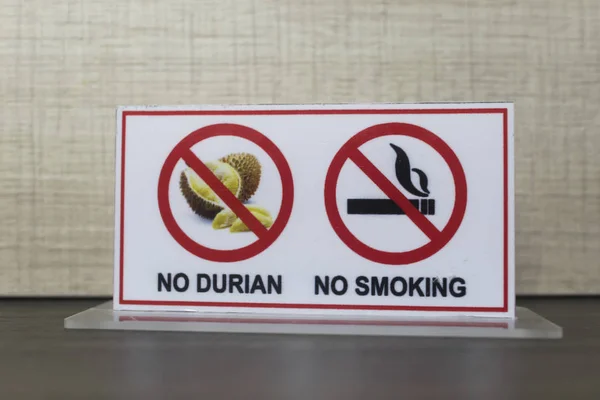 Hotel sign, warning, notice No durian, no smoking. Durian fruit is banned, restricted in Asian hotels because of its strong bad smell.
