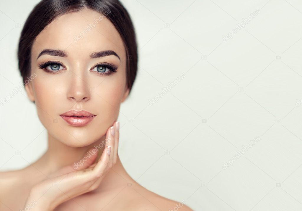 Woman face with young healthy skin