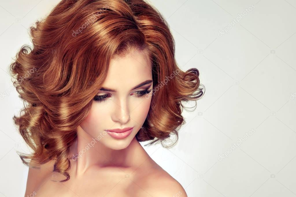 girl with long red curly hair