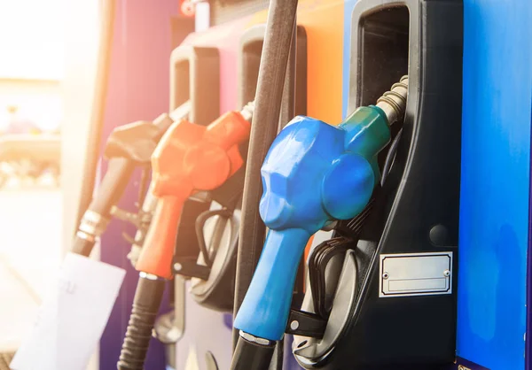 Fuel nozzle dispensing pump at gas station. The power concept. — Stock Photo, Image