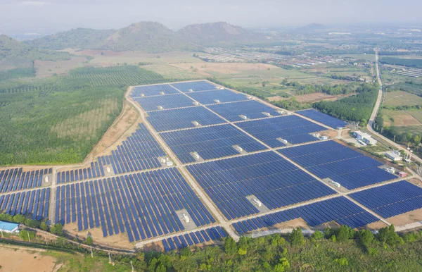 Solar cell energy farm. High angle view of solar panels on an energy farm. full frame background texture. Aerial view Power plant and Green Energy and global warming concept.