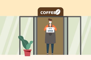 Kafe 'nin yüz maskesi takan girişimcisi elinde 