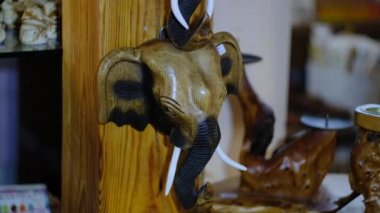 Wooden mask of an elephant in the shop of oriental souvenirs