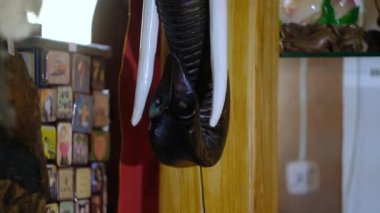 Wooden mask of an elephant in the shop of oriental souvenirs