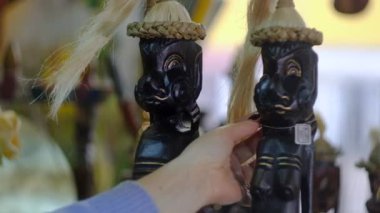 Oriental souvenirs in the store, hippos made of wood, turtles, fish