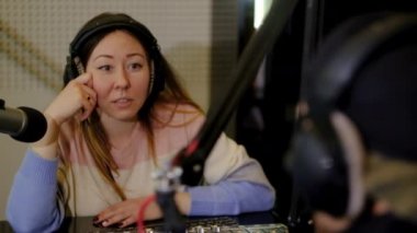 Girl radio host of a radio station.