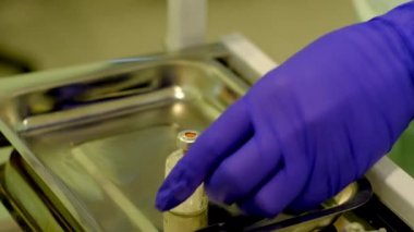 nurse preparing a medicine in a vial