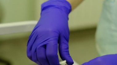 nurse prepares medicine against coronavirus in vial