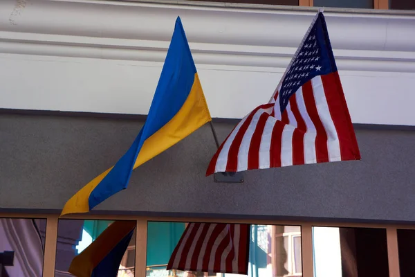 Two flags hang side by side — Stock Photo, Image