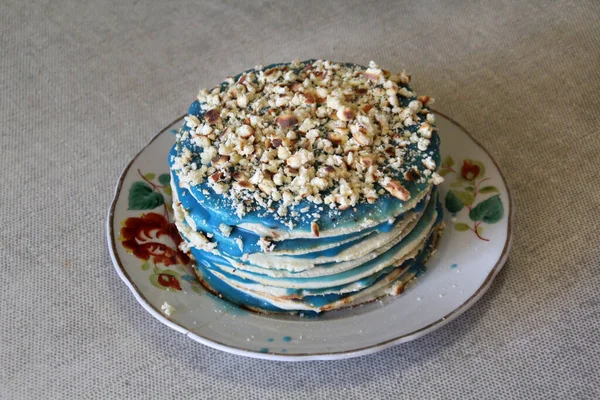 blue cream cake on a platter