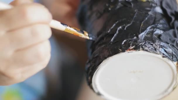 Female artist varnish black painted hand made bucket with a brush and lacquer — Stock Video