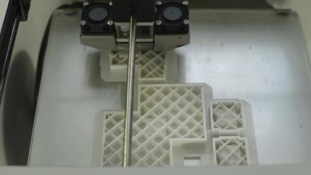 Technology. The work of a three-dimensional printer. 3D printer during printing close-up. Process of working 3D printer. — Stock Video