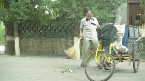 Male janitor with broom. Beijing. China. Asia — Stock Video