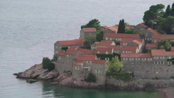 Houses with red tiled roofs. Architecture of Sveti Stefan. Montenegro. — Stock Footage Houses with red tiled roofs. Architecture of Sveti Stefan. Montenegro. Stock Video