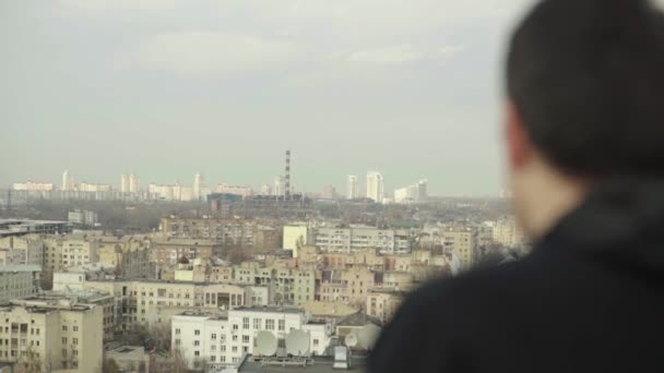 A man looks at a big city. Kyiv. Ukraine. — Stock Video