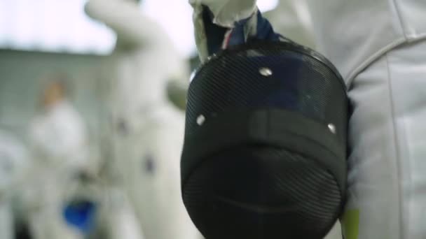 Fencing helmet. Close-up. Slow motion — Stock video