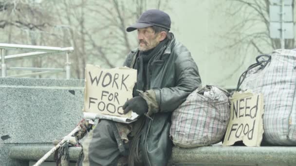 The inscription "Work for food" by the poor homeless tramp. Kyiv. Ukraine — Stock Video