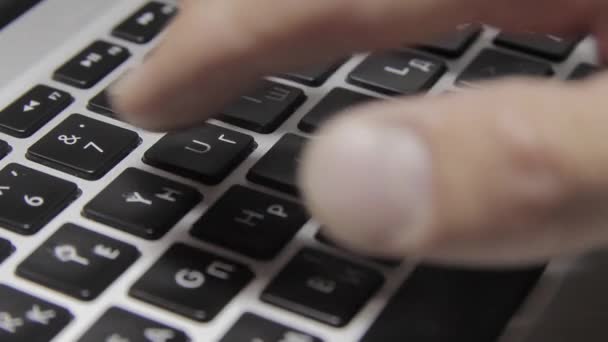 Hands are typing on a macbook keyboard. Close-up — Stock Video