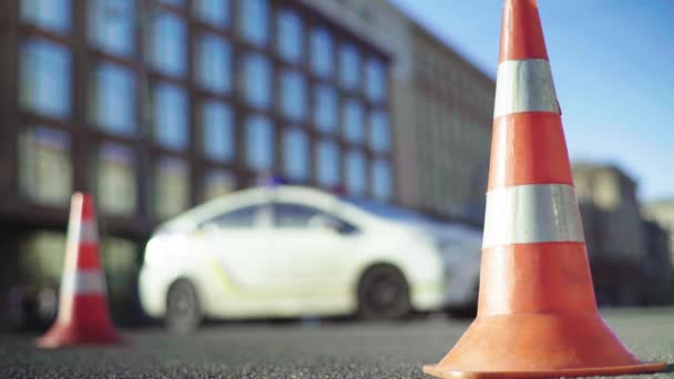 Police cone on the road. Place of accident. Transport. Road traffic. Sign. Kyiv. — ストック動画