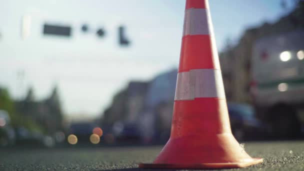 Police cone on the road. Place of accident. Transport. Road traffic. Sign. Kyiv. — ストック動画