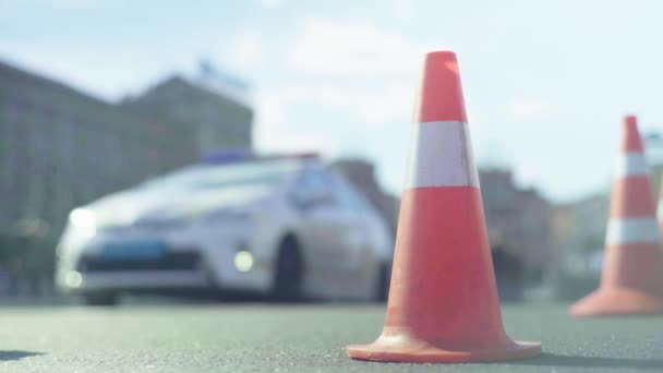 Police cone on the road. Place of accident. Transport. Road traffic. Sign. Kyiv. — Stock Video