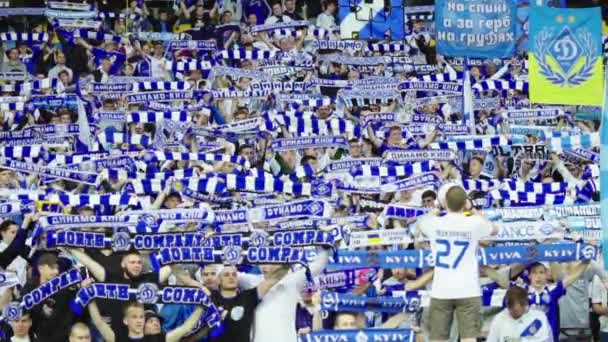 Fans at the stadium during the match. Slow motion. Olimpiyskiy. Kyiv. Ukraine. — ストック動画