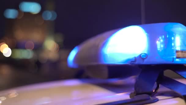 Flashing flasher on the roof of a police car at night. Blinker. — Stock Video