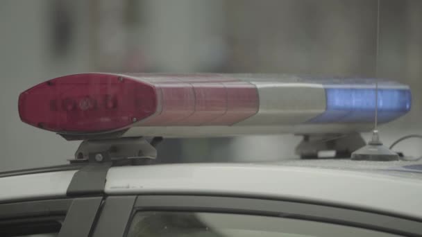 Flashing flasher on the roof of a police car. Blinker. Close-up. — Stock Video