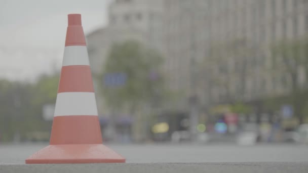 Police cone on the road. Place of accident. Transport. Road traffic. Sign. Kyiv. — ストック動画