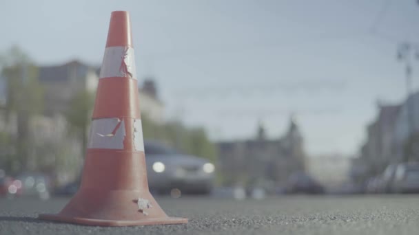 Police cone on the road. Place of accident. Transport. Road traffic. Sign. Kyiv. — ストック動画