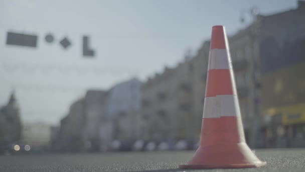 Police cone on the road. Place of accident. Transport. Road traffic. Sign. Kyiv. — ストック動画