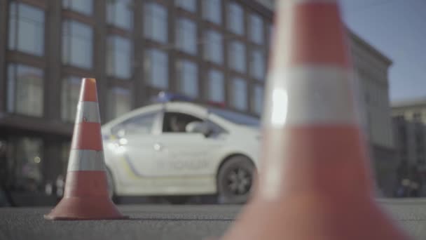 Police cone on the road. Place of accident. Transport. Road traffic. Sign. Kyiv. — Stock Video