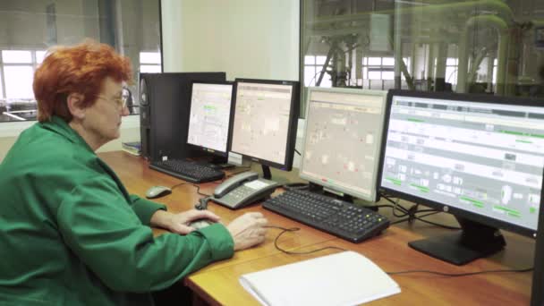 The work of the woman dispatcher in the control room at the factory. Technology. Kyiv. Ukraine. — Stock Video