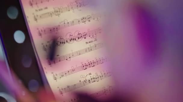 Sheet music on stage during the performance of the orchestra. Close-up. — Stock Video