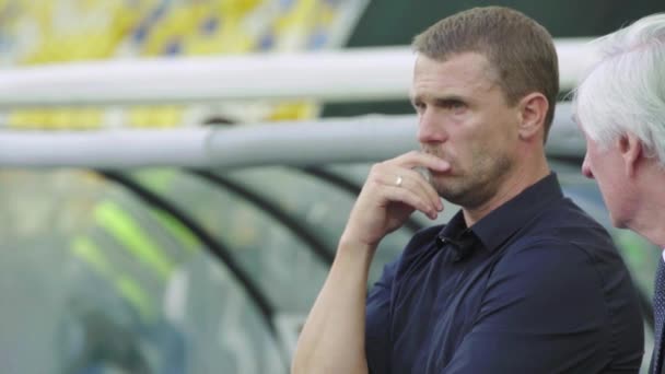 Football coach Sergiy Rebrov in the stadium during a football match. — Stock Video